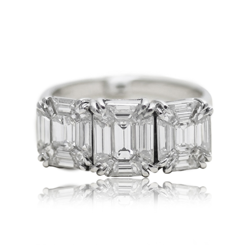 Emerald Step cut trilogy engagement ring